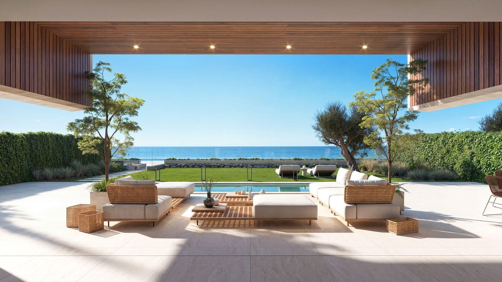 Luxe terras met uitzicht op de oceaan en stijlvolle buitenmeubels.